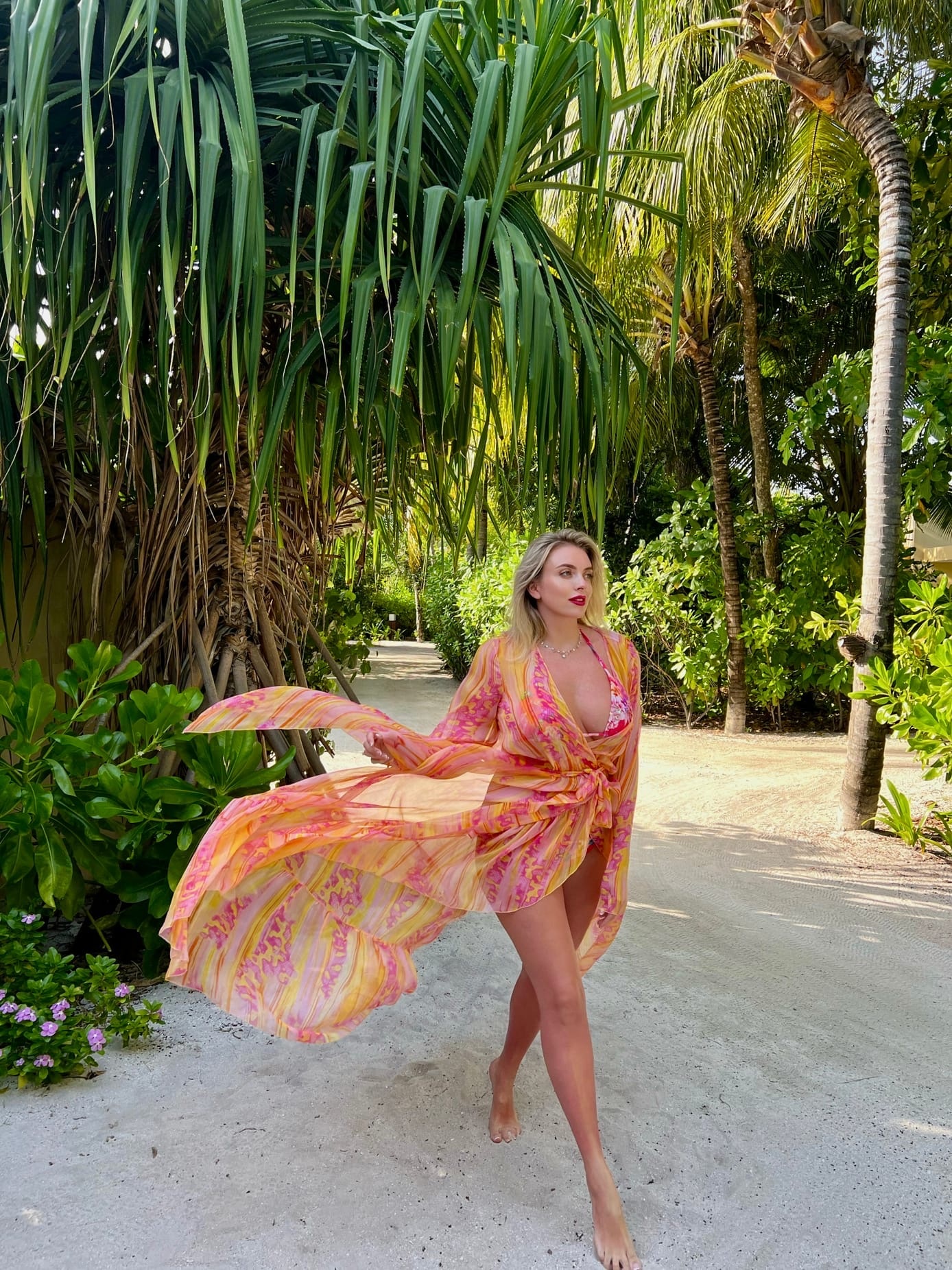 This is a portrait image with resolution 1388x1852, dominant color gray, approximately 5 main objects, containing 3 people.