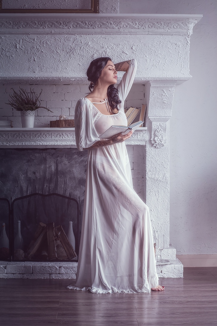 This is a portrait image with resolution 720x1080, dominant color gray, approximately 3 main objects, containing one person.