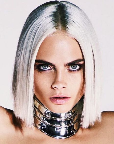 This is a portrait image with resolution 465x588, dominant color silver, approximately 3 main objects, containing one person.