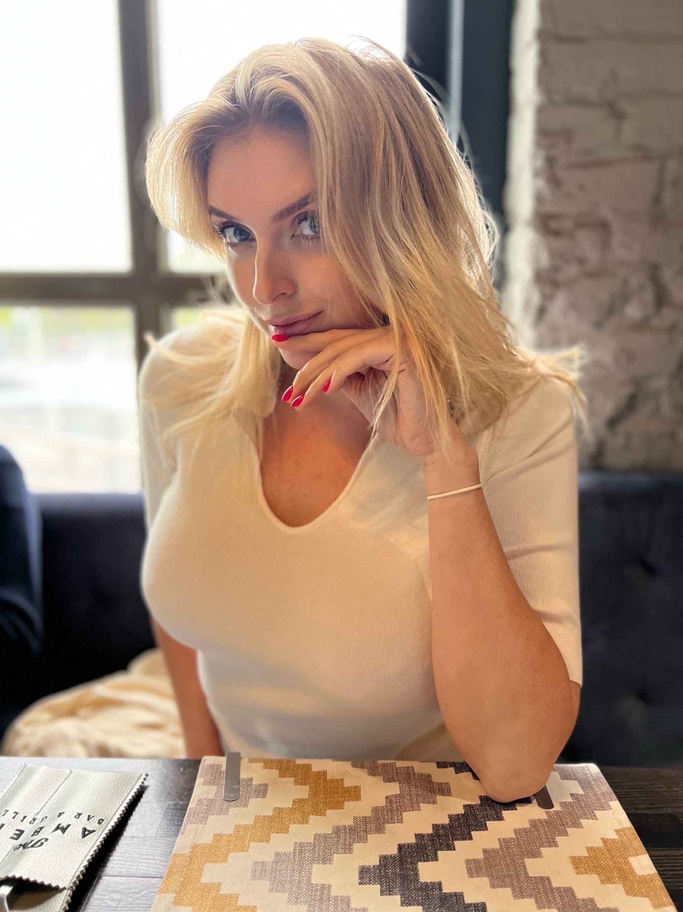 This is a portrait image with resolution 1388x1852, dominant color gray, approximately 5 main objects, containing 2 people.