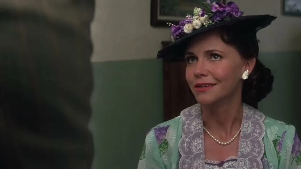 This is a landscape image with resolution 1280x720, dominant color black, approximately 1 main objects, containing 2 people.