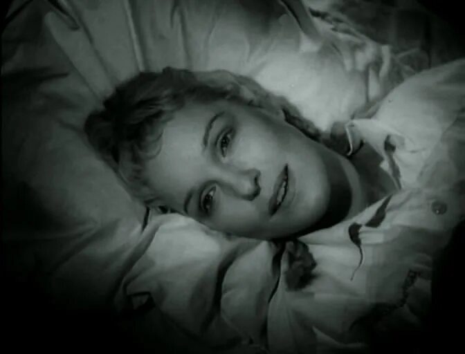 This is a landscape image with resolution 672x512, dominant color black, approximately 1 main objects, containing one person.