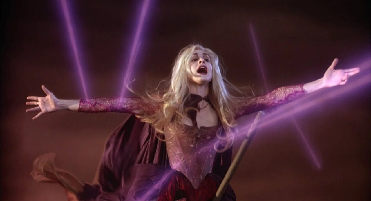 This is a landscape image with resolution 1279x693, dominant color maroon, approximately 1 main objects, containing 2 people.