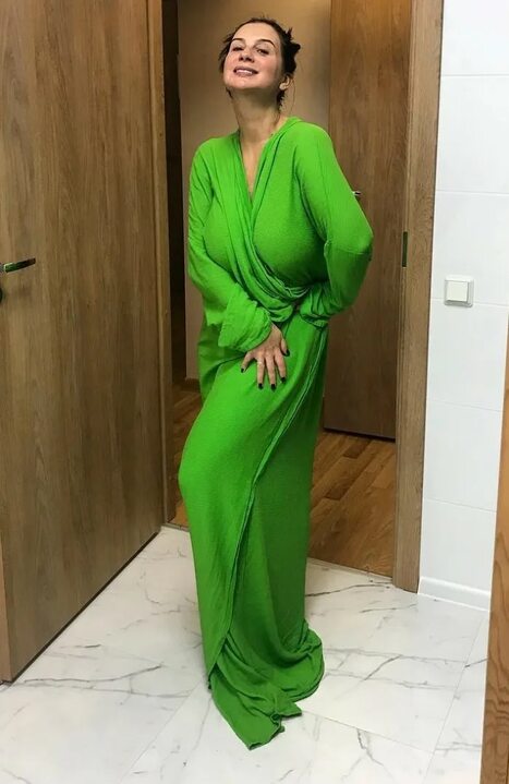 This is a portrait image with resolution 467x719, dominant color gray, approximately 1 main objects, containing one person.