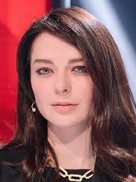 This is a portrait image with resolution 194x259, dominant color gray, approximately 1 main objects, containing one person.