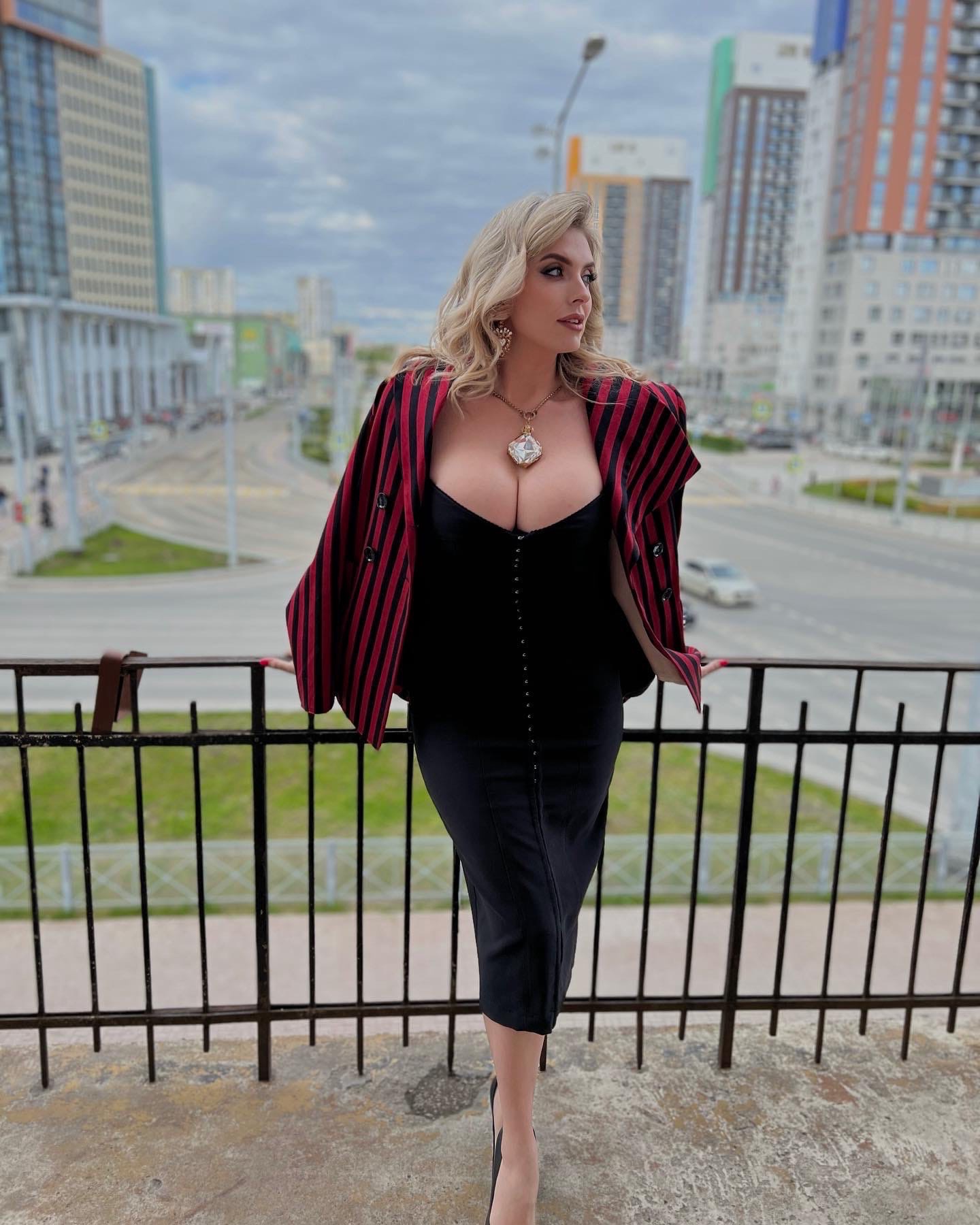 This is a portrait image with resolution 1440x1800, dominant color gray, approximately 4 main objects, containing 3 people.