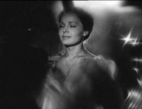 This is a landscape image with resolution 489x375, dominant color black, approximately 1 main objects, containing one person.