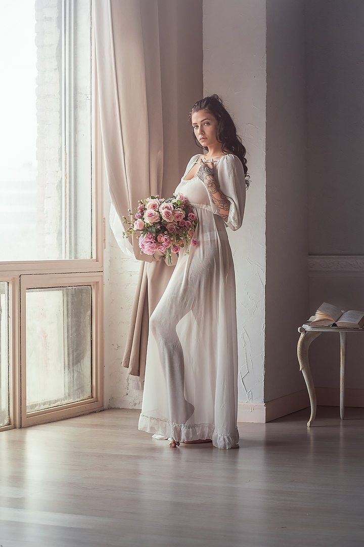 This is a portrait image with resolution 720x1080, dominant color gray, approximately 2 main objects, containing 2 people.