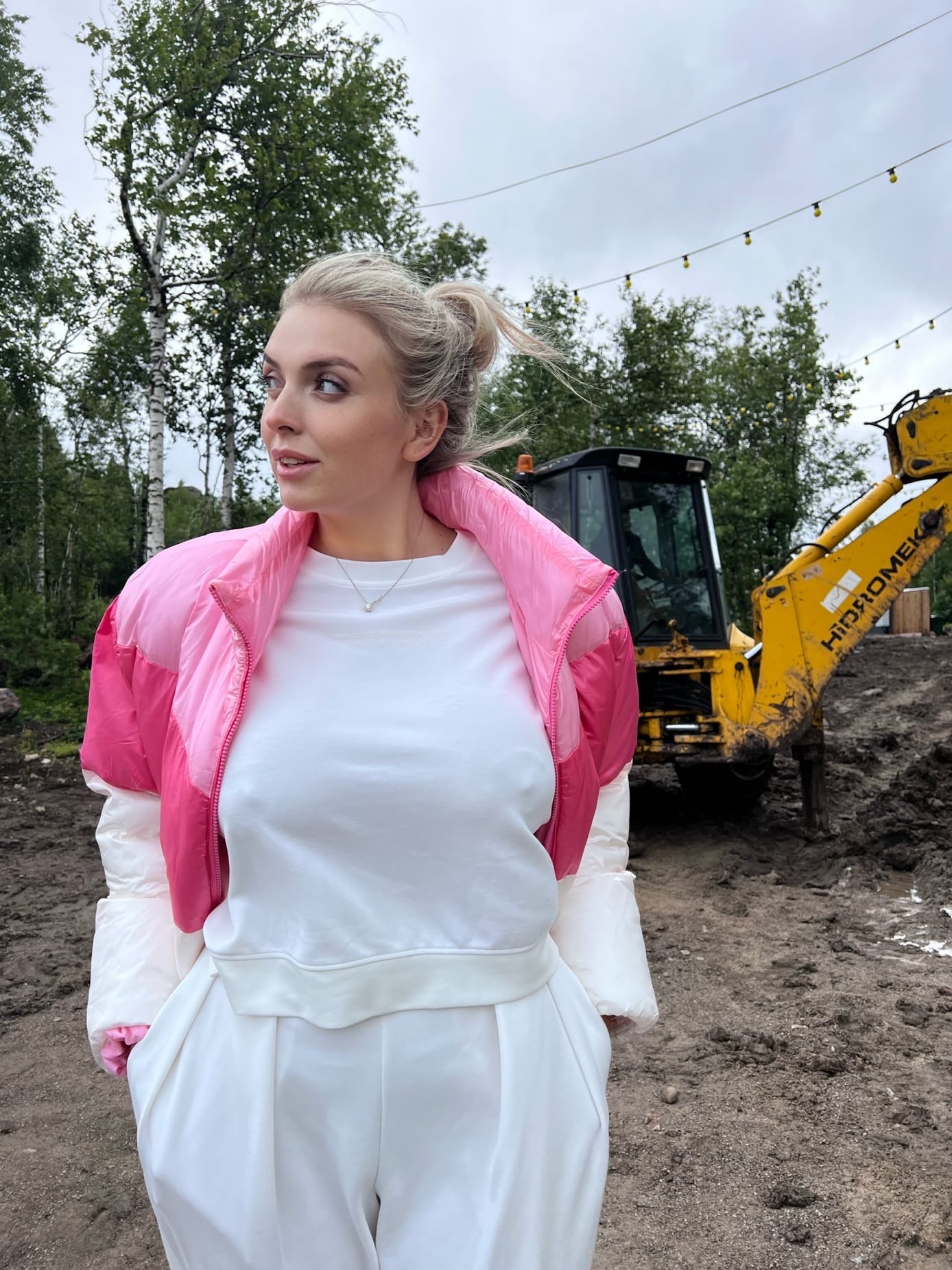 This is a portrait image with resolution 1388x1852, dominant color gray, approximately 5 main objects, containing 3 people.